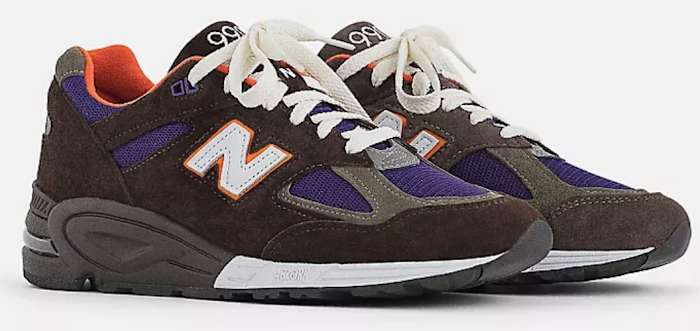 View of brown and purple New Balance shoes.